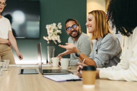 Cheerful businesswoman having a discussion with her colleagues